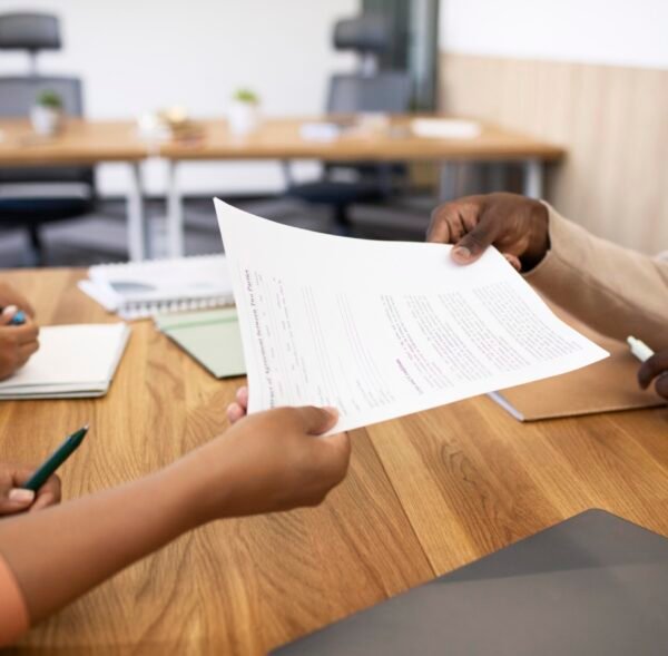 man-holding-contract-his-new-office-job-after-interview (1)