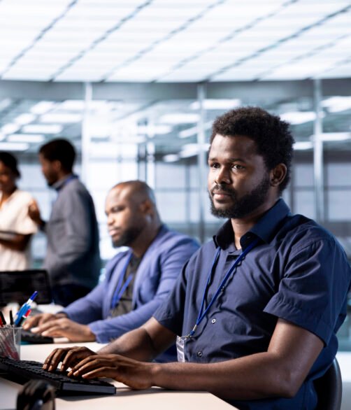 IT professional working in server room, repairing equipment